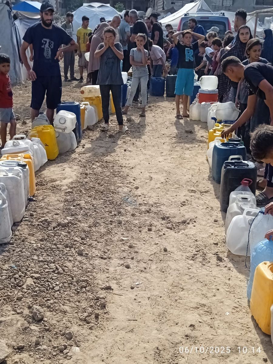 Families collecting clean water